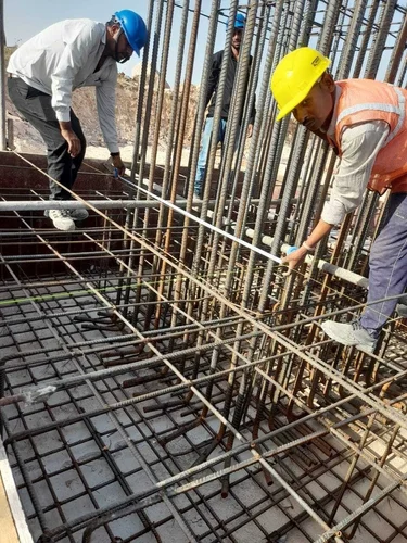 Construction team inspecting a large civil engineering site